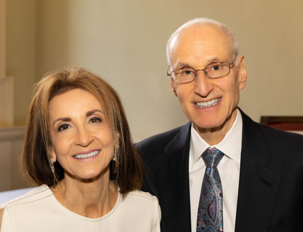 Smiling older couple in formal attire